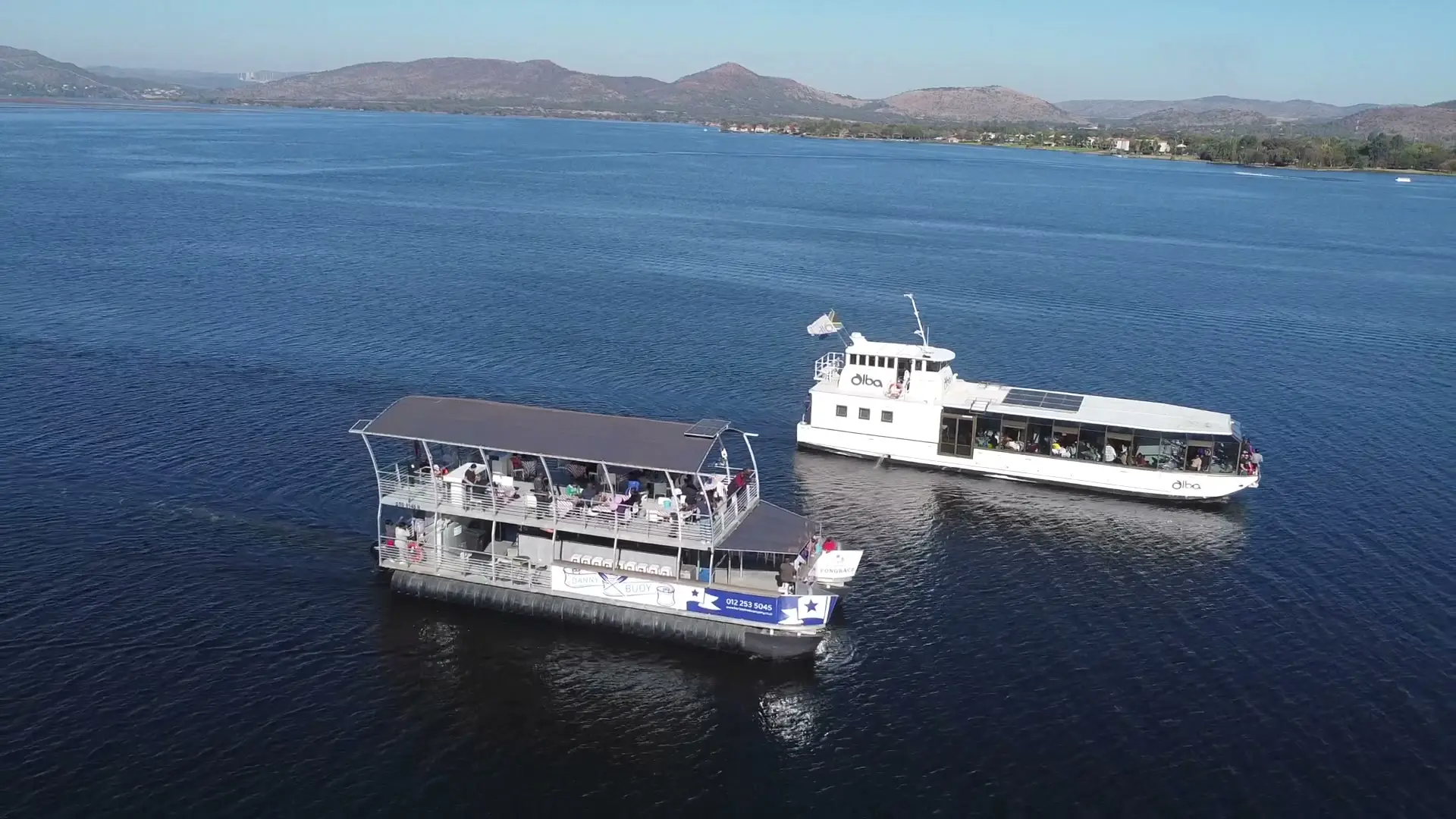 Danny Buoy and The Alba side by side on the open dam