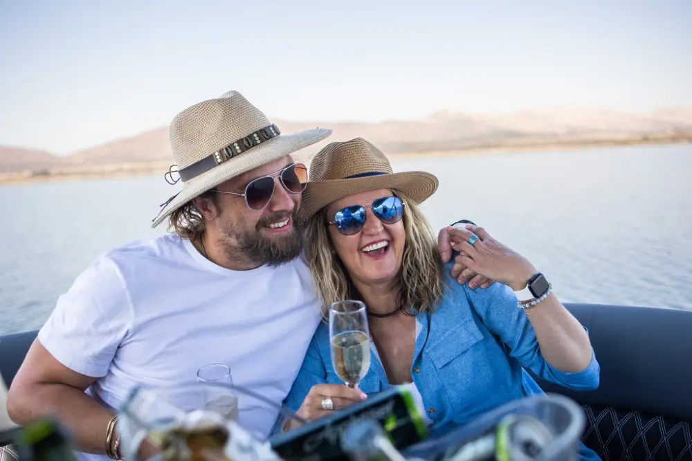 A couple in sunhats on a pontoon