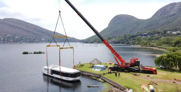 A crane lowering The Alba into Hartbeespoort Dam
