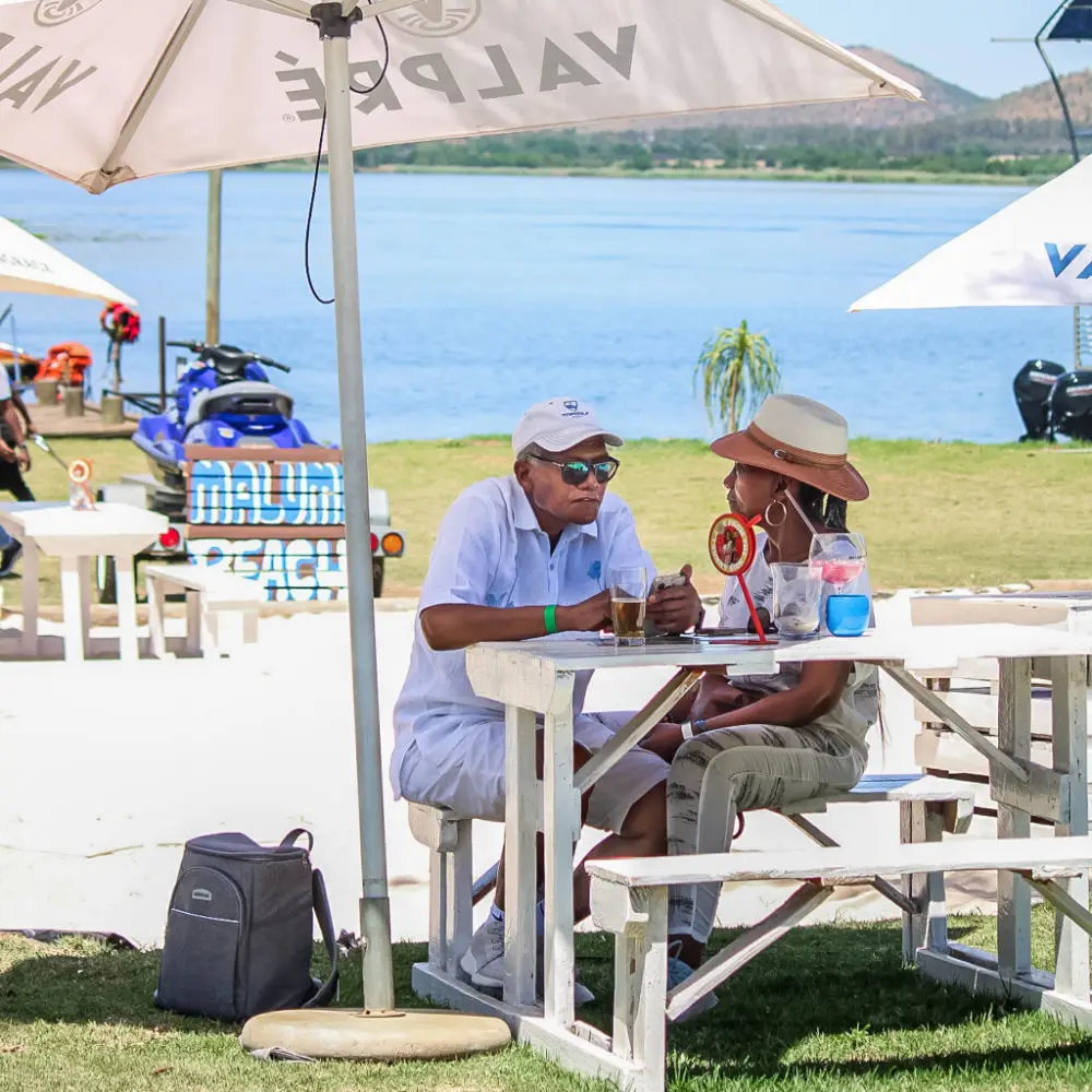 Guests at a table on the sand at Zanzibar Beach Café