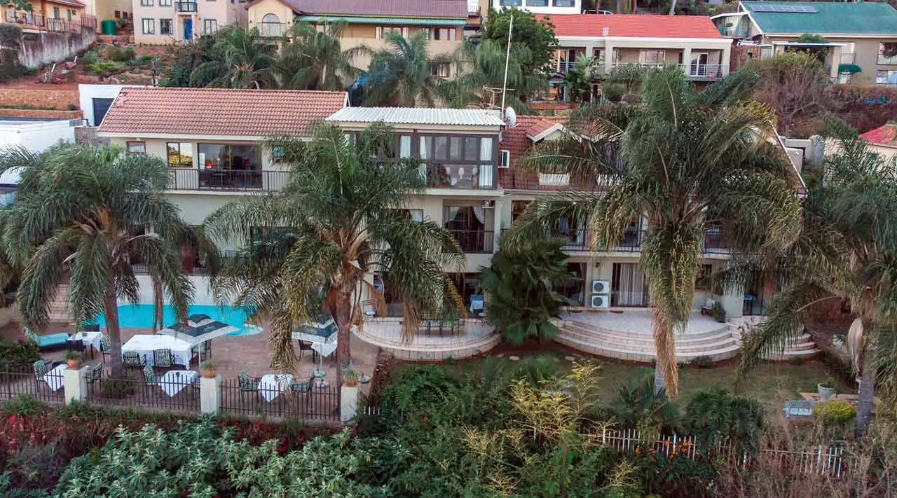 La Dolce Vita guest house among palms above the water