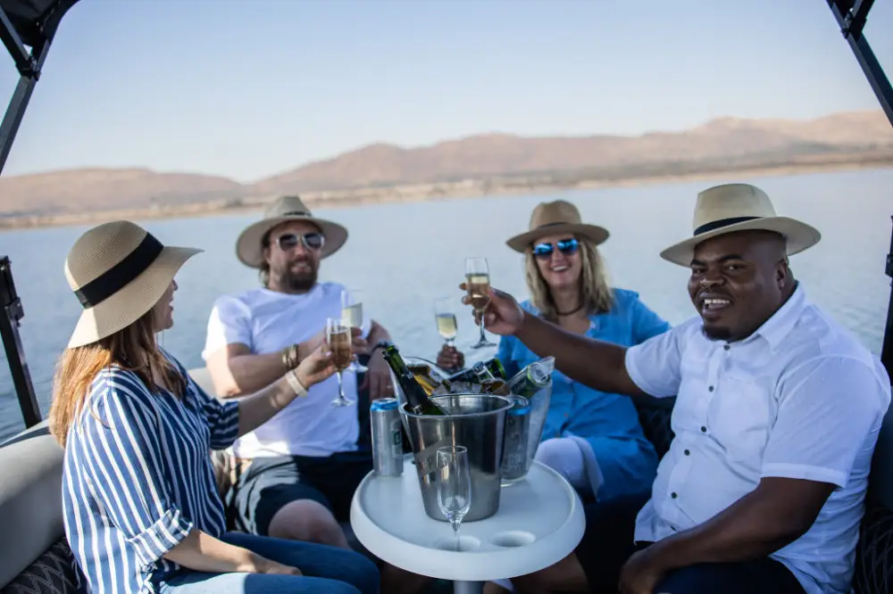 Friends toasting on a pontoon
